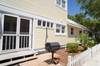 SIDE YARD WITH OUTDOOR GRILL AND SHOWER SIDE YARD WITH OUTDOOR GRILL AND SHOWER