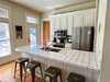 KITCHEN ISLAND WITH BARSTOOL SEATING FOR FOUR