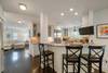 ADJACENT KITCHEN W/BAR SEATING FOR THREE ADJACENT KITCHEN W/BAR SEATING FOR THREE