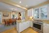 KITCHEN W/FOUR BURNER ELECTRICAL STOVE & BAR SEATING KITCHEN W/FOUR BURNER ELECTRICAL STOVE & BAR SEATING