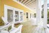 SPACIOUS FRONT PORCH WITH ADIRONDACK SEATING SPACIOUS FRONT PORCH WITH ADIRONDACK SEATING