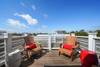 THIRD FLOOR DECK WITH SEATING FOR 4 AND TOWN VIEWS THIRD FLOOR DECK WITH SEATING FOR 4 AND TOWN VIEWS