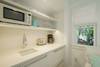 KITCHENETTE AREA WITH MICROWAVE, SINK, FRIDGE DRAWER KITCHENETTE AREA WITH MICROWAVE, SINK, FRIDGE DRAWER