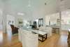 OPEN COMBINED LIVING, KITCHEN, AND DINING ROOM AT ENTRANCE