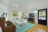 LIVING W/LARGE MOUNTED FLAT SCREEN TV