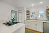 FULLY EQUIPPED KITCHEN NEXT TO OUTDOOR ACCESS