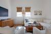 LIVING WITH TWO PLUSH LOUNGERS, PERFECT FOR MOVIE NIGHTS IN LIVING WITH TWO PLUSH LOUNGERS, PERFECT FOR MOVIE NIGHTS IN