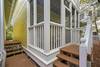 REAR PORCH EXTERIOR EXIT TO SANDY FOOT PATH REAR PORCH EXTERIOR EXIT TO SANDY FOOT PATH