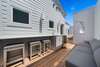 PRIVATE ROOFTOP PATIO AT RESIDENCE WITH WET BAR AND SEATING