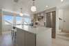 KITCHEN W/ LIEBHERR REFRIGERATOR & WESTWARD VIEW