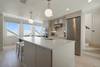 KITCHEN W/ LIEBHERR REFRIGERATOR & WESTWARD VIEW KITCHEN W/ LIEBHERR REFRIGERATOR & WESTWARD VIEW