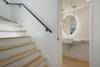 VIEW OF HALF BATH AT BASE OF STAIRS TO SECOND LEVEL VIEW OF HALF BATH AT BASE OF STAIRS TO SECOND LEVEL