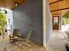 SHARED PORCH W/OUTDOOR SHOWERS, ADIRONDACK SEATING, & ENTRANCE T SHARED PORCH W/OUTDOOR SHOWERS, ADIRONDACK SEATING, & ENTRANCE T