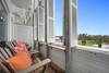 BALCONY OFF LIVING WITH SEATING AND TOWN VIEWS BALCONY OFF LIVING WITH SEATING AND TOWN VIEWS