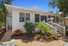SHADED YARD AND PRIVATE PORCH AT THE HOME, WALK TO BEACH