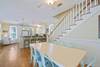 DINING FACING KITCHEN AND STAIRCASE LEADING TO SECOND LEVEL DINING FACING KITCHEN AND STAIRCASE LEADING TO SECOND LEVEL