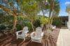 SIDE YARD WITH SEATING AND OUTDOOR SHOWER SIDE YARD WITH SEATING AND OUTDOOR SHOWER