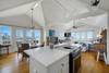 KITCHEN FACING DINING AREA SURROUNDED BY GULF VIEWS KITCHEN FACING DINING AREA SURROUNDED BY GULF VIEWS