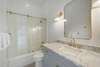 RENOVATED MARBLE BATHROOM W/GLASS ENCLOSED TUB& SHOWER COMBO
