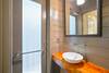 HALF BATHROOM LOCATED OFF OF THE LIVING AREAS; ACCESSES OUTDOOR HALF BATHROOM LOCATED OFF OF THE LIVING AREAS; ACCESSES OUTDOOR