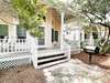 SPACIOUS BACK PORCH WITH OUTDOOR GRILL AND SEATING