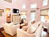 OPEN LIVING AREA WITH SEATING FOR ALL AND FLATSCREEN