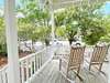 FRONT PORCH ROCKERS VIEW TO PRIVATE FENCED IN YARD