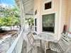 PORCH WITH SEATING AND OUTDOOR DINING TABLE FOR TWO