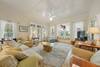 LIVING ROOM W/LARGE FLAT SCREEN, AMPLE SEATING, & BAY WINDOW LIVING ROOM W/LARGE FLAT SCREEN, AMPLE SEATING, & BAY WINDOW