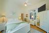QUEEN ROOM WITH MOUNTED FLATSCREEN TV AND STORAGE QUEEN ROOM WITH MOUNTED FLATSCREEN TV AND STORAGE
