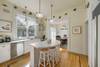 ADJACENT KITCHEN WITH BAR TOP SEATING FOR THREE ADJACENT KITCHEN WITH BAR TOP SEATING FOR THREE