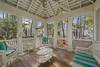 SPACIOUS BACK PORCH WITH CUSHIONED OUTDOOR SEATING SPACIOUS BACK PORCH WITH CUSHIONED OUTDOOR SEATING