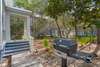 OUTDOOR GRILL AND PLENTY OF SHADE SURROUNDING COTTAGE