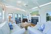 LIVING AREA WITH TWO COUCHES, CHAIR, FIREPLACE, AND FLATSCREEN T LIVING AREA WITH TWO COUCHES, CHAIR, FIREPLACE, AND FLATSCREEN T