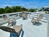 OPEN AIR ROOFTOP DECK W/ADIRONDACK SEATING FOR 4 OPEN AIR ROOFTOP DECK W/ADIRONDACK SEATING FOR 4
