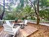 REAR SHADED DECK W/ADIRONDACK SEATING FOR THREE REAR SHADED DECK W/ADIRONDACK SEATING FOR THREE