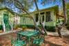 REAR OF HOME VIEW WITH OUTDOOR DINING FOR FOUR