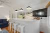 LARGE CENTER ISLAND VIEW TO UPDATED KITCHEN & TV LARGE CENTER ISLAND VIEW TO UPDATED KITCHEN & TV