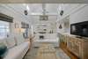 LIVING ROOM WITH TWO LARGE SOFAS