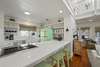 RENOVATED KITCHEN W/BAR SEATING FOR THREE