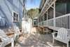 OUTDOOR LOUNGE AND DINING SPACE ON SIDE OF COTTAGE