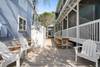 OUTDOOR LOUNGE AND DINING SPACE ON SIDE OF COTTAGE OUTDOOR LOUNGE AND DINING SPACE ON SIDE OF COTTAGE