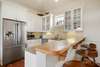 KITCHEN ALTERNATE VIEW WITH BARSTOOL SEATING