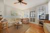 LIVING WITH FLATSCREEN TV AND FRONT PORCH ACCESS LIVING WITH FLATSCREEN TV AND FRONT PORCH ACCESS