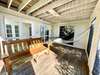 SCREENED PORCH W/SWING & BENCH SEATING