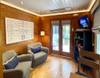 LIVING AREA OFF FRONT ENTRANCE, 2 SWIVEL CHAIRS, LARGE SMART TV LIVING AREA OFF FRONT ENTRANCE, 2 SWIVEL CHAIRS, LARGE SMART TV