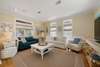 OPEN LIVING ROOM OFF ENTRANCE FOYER AND FRONT PORCH