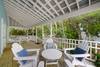 OPEN, FURNISHED BACK PORCH OVERLOOKING SHADED YARD OPEN, FURNISHED BACK PORCH OVERLOOKING SHADED YARD