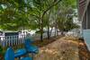 SIDE YARD OVERLOOKING 30A W SEATING, SHADE AND GRILL SIDE YARD OVERLOOKING 30A W SEATING, SHADE AND GRILL