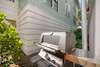 OUTDOOR GAS GRILL OFF REAR OF HOME